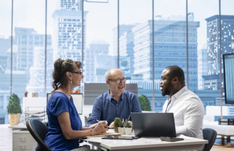 Mature couple engaged in a serious discussion over Commercial Office Insurance